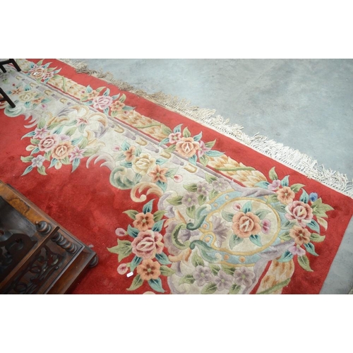 3492 - Chinese Wool Rug With Floral Decoration on a Red Ground approx. 280cm x 370cm