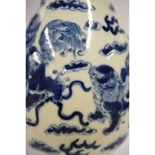 1531 - Chinese B & W Bottle Shaped Vase, painted with Foo Dogs (Temple Lions), approx 31cm tall, painted fo... 