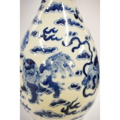 1531 - Chinese B & W Bottle Shaped Vase, painted with Foo Dogs (Temple Lions), approx 31cm tall, painted fo... 