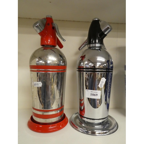 1069 - Two Chrome Plated Soda Syphons on Stands.