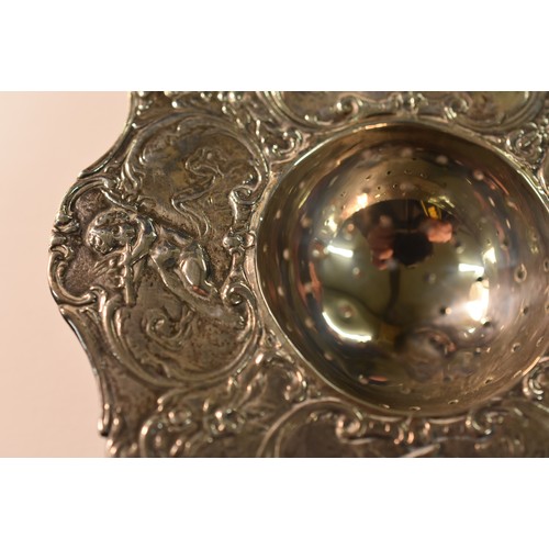 2150 - Chester Silver Tea Strainer, Maker BM. Embossed Decoration with Cherubs and Figures. (2.5 Ounces Tro... 