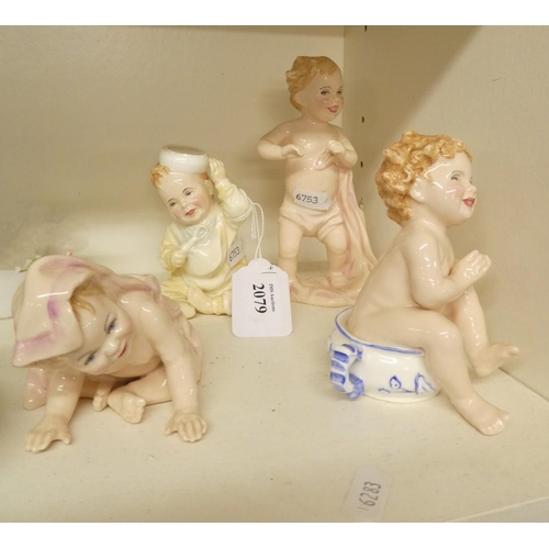 2079 - Four Royal Doulton Infant Figurines.