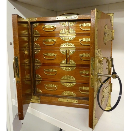 1066 - Modern Reproduction Japanese Cabinet of Drawers with Decorative Brass Mounts.