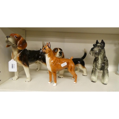 1080 - Four Collectors Ceramic Dog Ornaments.