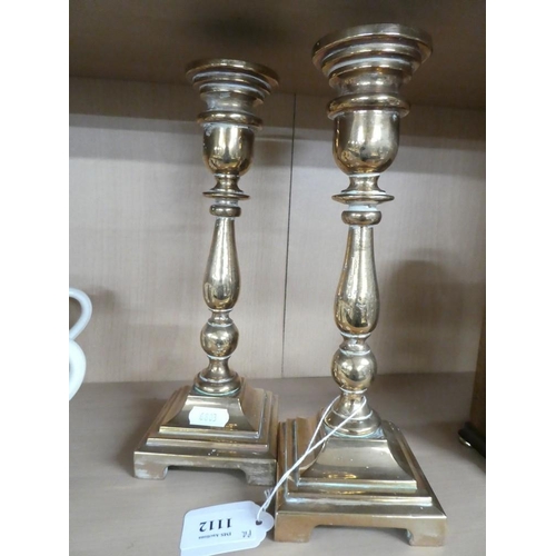 1112 - Pair of Bell Metal Candlesticks, approx 25cm tall.