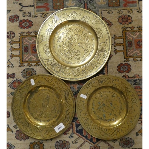 2097 - Three Oriental Brass Wall Plates.