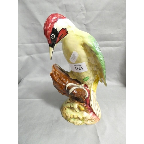 1164 - Beswick Green Woodpecker Model Number 1218, approx 22.5cm tall.