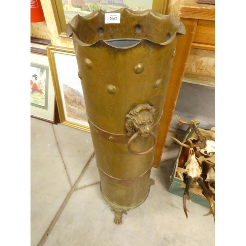 2062 - Copper Bound Brass Umbrella Spill with Lion Handles, approx 74cm tall.