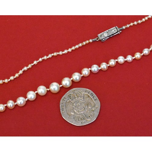 2612 - Strand of Antique Graduated Pearls. Length 50cms. The White Metal Fastener is set with 4 x Cushion C... 