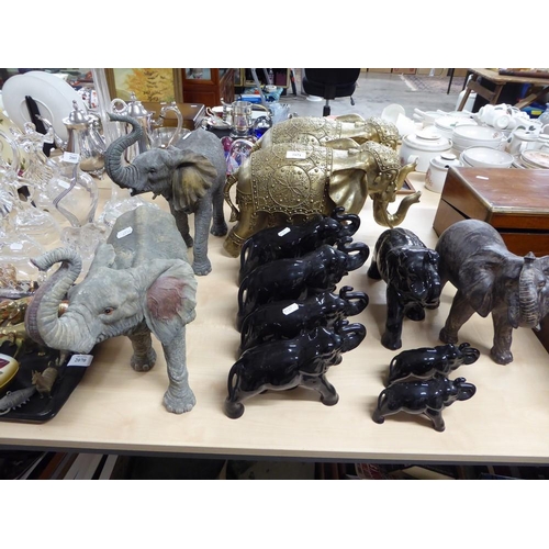 2071 - Twelve Resin & Pottery Elephants.