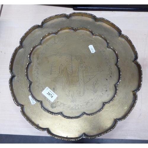 2074 - Two Circular Engraved Chinese Brass Trays.