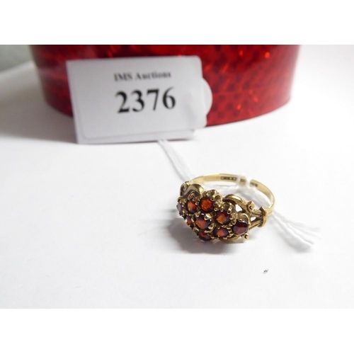 2376 - 9ct Rose Gold Garnet Encrusted Dress Ring, UK size Q, approx 3.1g.