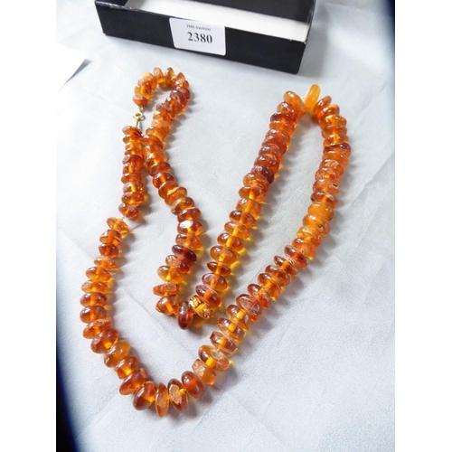 2380 - Graduated Golden Amber Necklace, approx 74cm long, weighs 70g (largest bead measuring approx 18mm ac... 