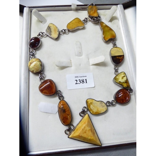 2381 - 925 Sterling Silver & Amber Necklace in Case, 53cm long, weighs approx 93.5g