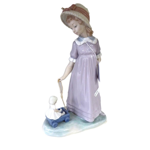 1010 - Lladro Porcelain Figurine - Young Girl with Pull-along Toy, approx 27cm tall.
