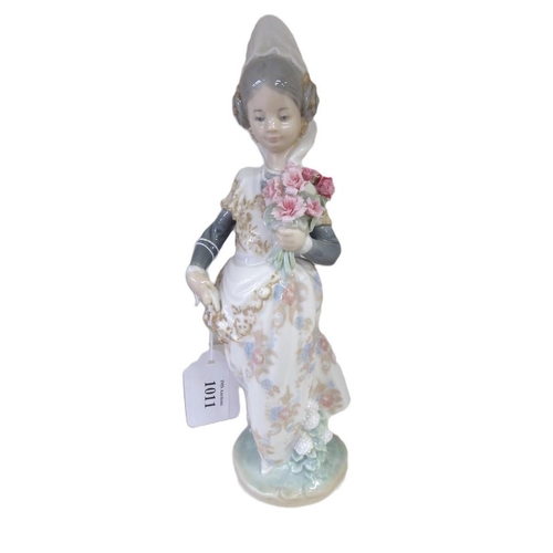 1011 - Lladro Porcelain Figurine - Girl in Traditional Dress, approx 24cm tall.