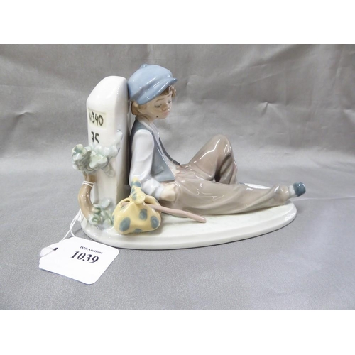 1039 - Lladro Porcelain Figurine - 5399 Young Tramp Resting by Milestone, approx 12cm tall.