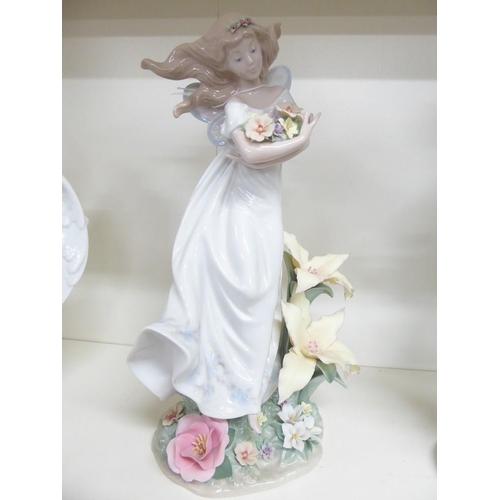 1088 - Lladro Porcelain Figurine - Girl Holding Flowers, approx 32cm tall.