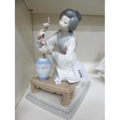 1098 - Lladro Porcelain Figurine - Japanese Lady Tending Plant, approx 19cm tall.