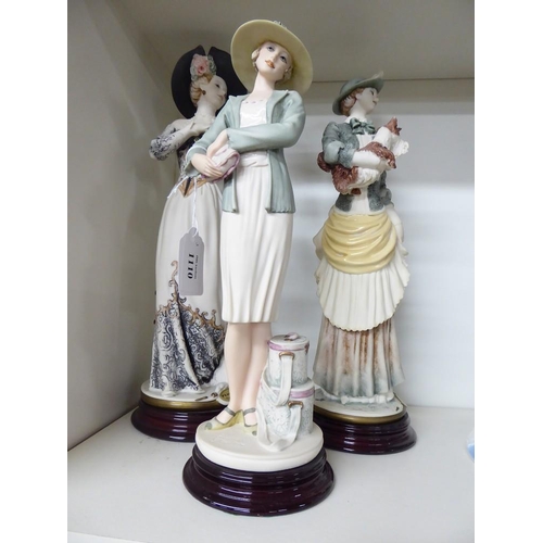1110 - Three Decorative Composite Figurines.
