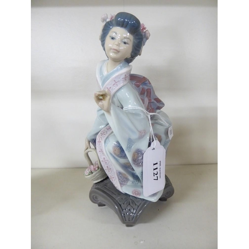 1127 - Lladro Porcelain Figurine - Japanese Lady with Flowers, approx 19cm tall.