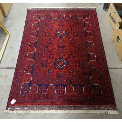 2447 - Fine Eastern Wool Rug, Deep Red Ground, approx 144 x 104cm.