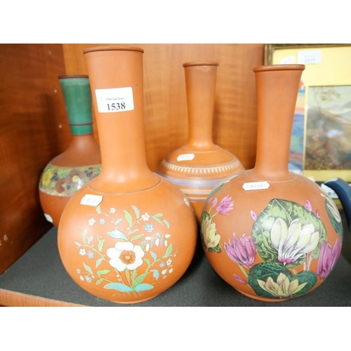 1538 - Four Terracotta Bottle Shaped Vases, all around 26cm tall.