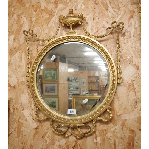 2056 - Gilded Wall Mirror, the Frame with Urn surmount flanked with laurel leaf swags, approx 60cm tall.