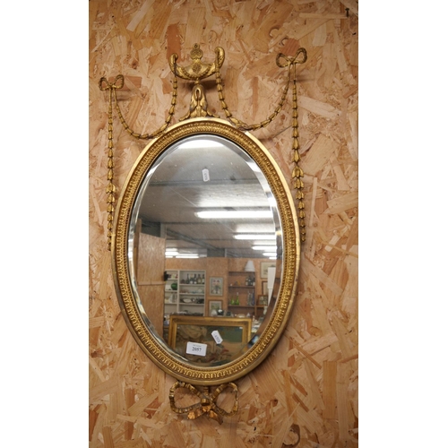 2057 - Gilded Wall Mirror, Urn shaped surmount, flanked with laurel leaf swags, approx 75cm tall.