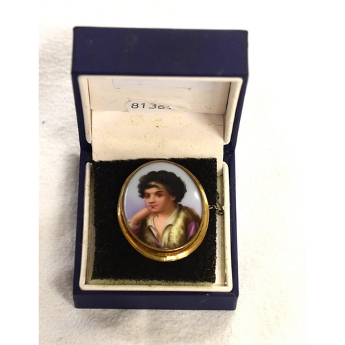 2477 - Porcelain Brooch painted with young boy, 9ct gold mount.