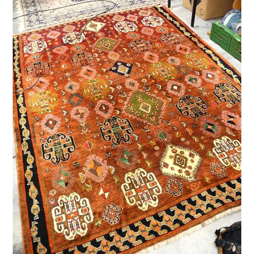 2532 - Large Eastern Wool Rug Orange to Red Ground with Colourful Motifs 187cm x 266cm.
PLEASE NOTE THAT DU... 