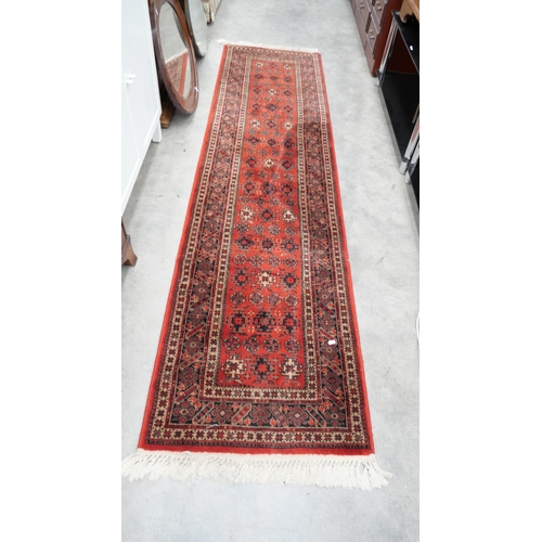 3220 - Fringed and Bordered Geometric Rug on Red Ground 268cm x 67cm