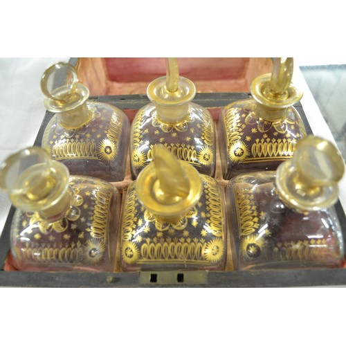 1388 - Antique 6 Bottle Decanter Box & Two Drinking Glasses, all components with gilded decoration.