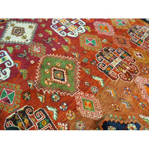 2532 - Large Eastern Wool Rug Orange to Red Ground with Colourful Motifs 187cm x 266cm.
PLEASE NOTE THAT DU... 