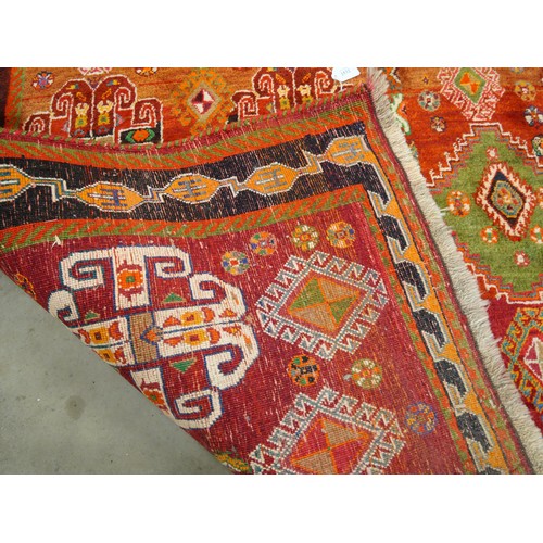 2532 - Large Eastern Wool Rug Orange to Red Ground with Colourful Motifs 187cm x 266cm.
PLEASE NOTE THAT DU... 