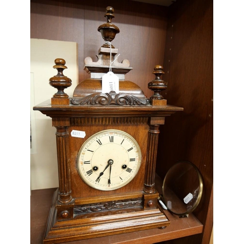 1109 - Antique Wooden Mantel Clock, Roman Numerals, Turned Wood Finials, with Winding Key, approx 44cm tall... 