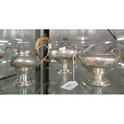 1166 - Hammered Pewter Three Piece Tea Service.