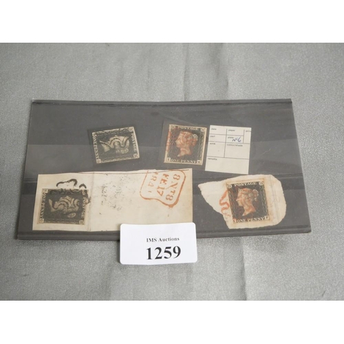 1259 - Four Victorian Penny Black Stamps.