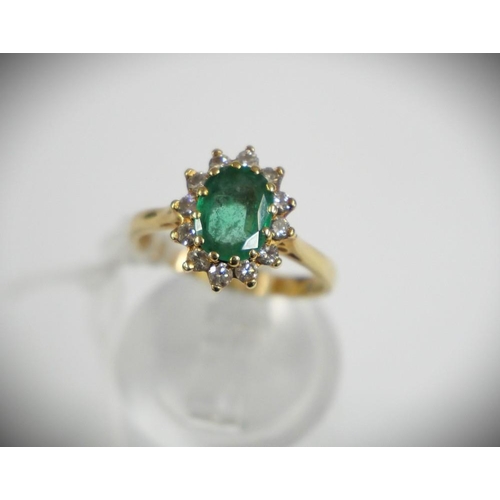 2350 - 18ct Gold Emerald and 12 Diamond Oval Cluster Ring - Size UK J 1/4.