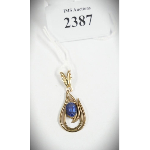 2387 - Yellow Metal Pendant Inset with Blue Stone.