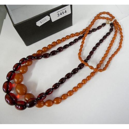 2414 - Two Amber Coloured Graduated Necklaces.