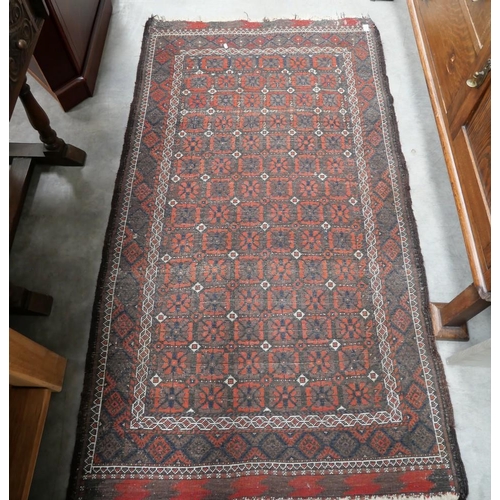 3003 - Antique Geometric Wool Rug on Red Ground 169cm x 98cm