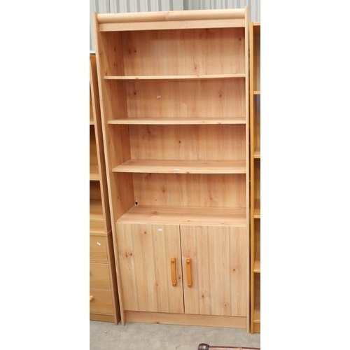 3066 - Pine Effect Bookcase with Cupboard Base