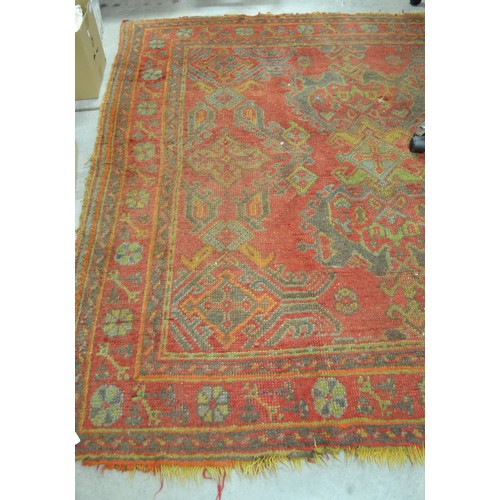 2465 - Fringed & Bordered Geometric Woolen Rug On Red Ground (Approx. 202cm x 190cm)