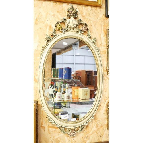 2027 - Oval Upright Wall Mirror with Urn Decorated Crest, approx 76cm tall.