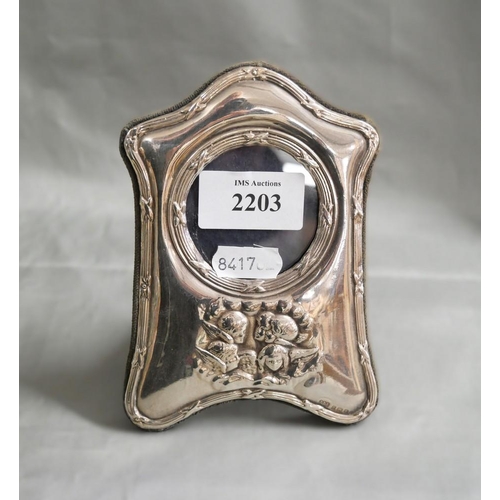 2203 - Small Edwardian Style Birmingham Silver Photo Frame, decorated with Cherubs, maker RBB, approx 14cm ... 