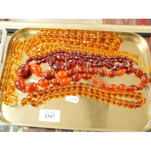 2347 - Box - Assorted Amber Coloured Necklaces.