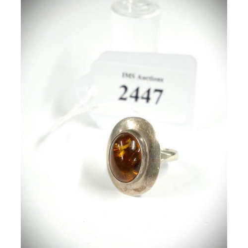 2447 - Amber Mounted Silver Dress Ring, Size UK Q, total weight 8.6g