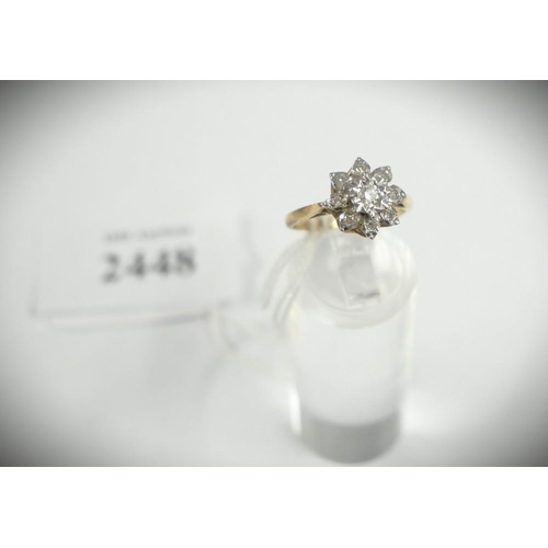 2448 - 18ct Gold & Diamond Flowerhead Ring surrounded with 8 smaller Diamonds, Size Uk L, total weight 3.6g