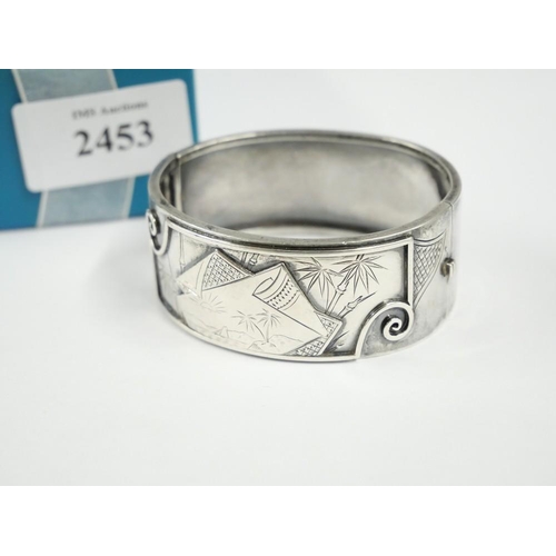 2453 - Late Victorian Engraved White Metal Bangle, weighing approx 34g.